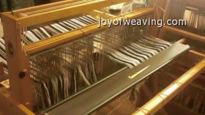 The weaving reed is easier to thread when it's laying flat