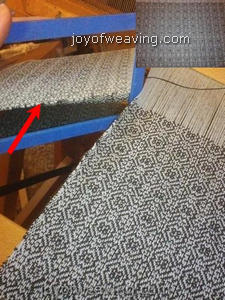 Use a mirror or take a photograph of the web to easily spot weaving mistakes