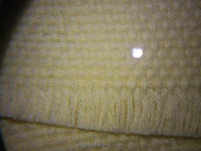 Fusible Sewing Thread in The Web Under Magnification